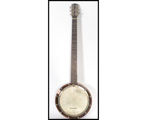 An early 20th century 4 string banjo musical instrument the head stock stamped no.45.