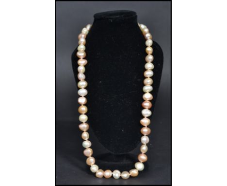 &nbsp;vintage freshwater pearl necklace strand. The pearls of varying form but similar size.