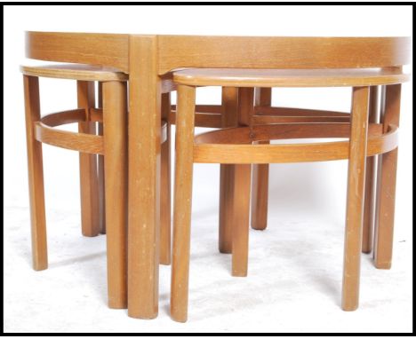 Nathan Furniture - A vintage 1970's teak framed trinity coffee table in the circles pattern having inset glass top with three