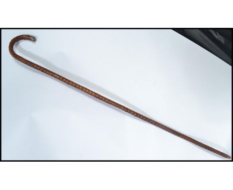 An early 20th century silver hallmarked mounted walking stick cane having a tapering a shaped blackthorn black thorn wood sha