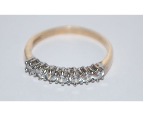 A hallmarked 9ct 7 stone gold ring set with 7 white stones.&nbsp; &nbsp;Hallmarked&nbsp; Sheffield. Size R.&nbsp; Weight 2.6g