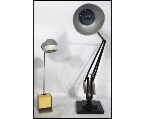 A 1940's Industrial pre-war Herbert Terry anglepoise lamp, raised on a cast metal two step base with pendant shade, finished 