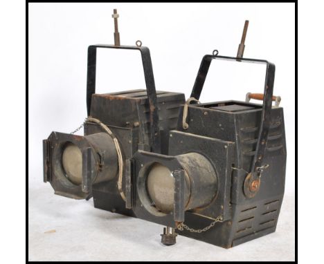 A good pair of large mid 20th century Industrial Strand Electric Theatre Spot lights with bracket atop original paintwork and