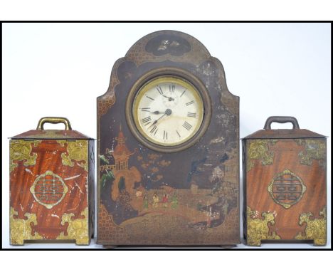 An early 20th century novelty biscuit / sweet tin in the form of a mantle clock depicting chinoiserie decoration along with a