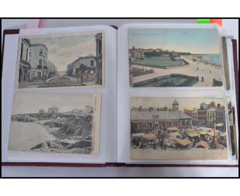 Postcards; an album of assorted vintage postcards, largely views of seaside towns / villages. Many real photo cards, some art