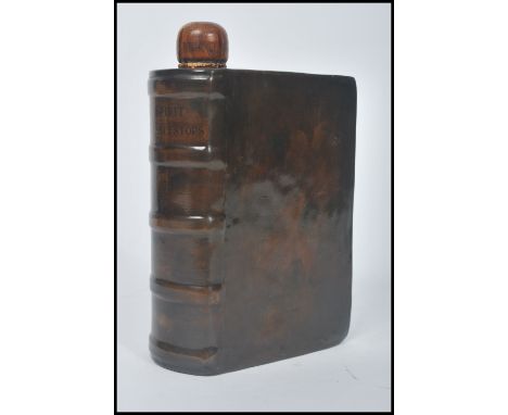 An unusual Royal Doulton earthenware spirit flask, in the form of a leather book, entitled The Spirit Of Our Ancestors, Vol. 