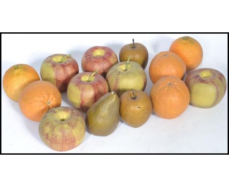 A group of early 20th century ceramic fruit ornaments to include oranges and apples. Hand painted with stems. Measures to sca