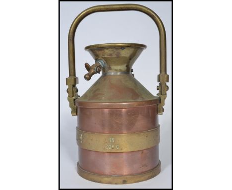 A vintage 20th century&nbsp;four gallon copper petrol measure by Wragg Brothers of Wickford, Essex. Stamped to side. Measures