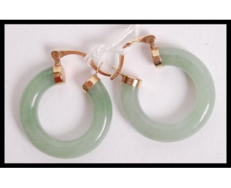 A pair of hallmarked Jade and 9ct gold hoop earrings, the gold mounts marked with makers marks for JDK with Birmingham assay 