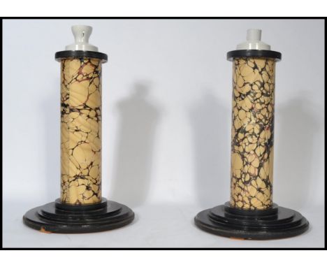 A pair of 20th century electric faux marble matching table lamps the faux marble columns raised on turned bases. 49cm tall.&n