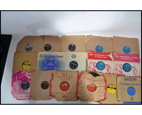 A collection of 78rpm records to include Elvis Teddy Bear, Blue Suede Shoes, Don't Be Cruel, Blue Moon, My Baby Left Me, Litt