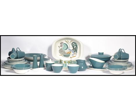 A mid century Poole dinner and tea service in a light blue colourway including a lazy Susan. Please see images. Widest measur