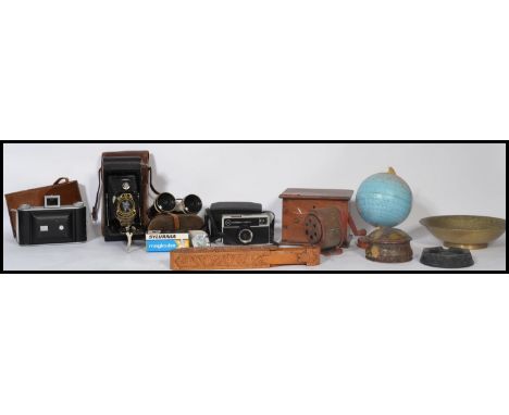 A collection of vintage items to include a wooden money box with initials T.S a tin desk top globe , Indian brass bowl , carv