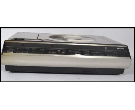 A vintage 20th century Phillips VLP-700 lazerdisc laserdisc player with acrylic cased top and dials to front. Measures 16 cm 
