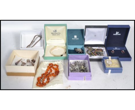 A group of vintage sterling silver jewellery to include necklaces , bracelets , pendants , charms etc. Mostly held within vin