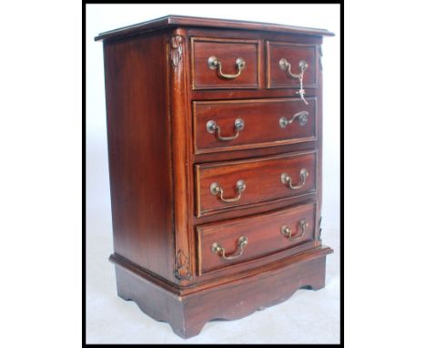 A 20th century antique style mahogany bachelors chest of drawers. Of small proportions raised on bracket feet having a series