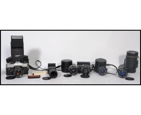 A vintage SLR Fujica ST901 Auto Electro camera with 55mm lens. Together with a 35mm Optomax lens in case, Fujinow lens 33mm, 