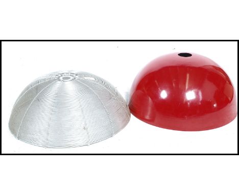 &nbsp;A pair of vintage 20th century pendant ceiling&nbsp; light shade / fixtures one in a vivid red finish whilst the other 