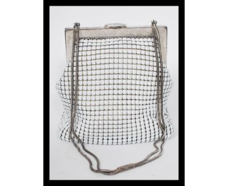 A vintage 20th century Oraton West German handbag with matching belt. The bag having original mirror to interior.