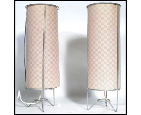 A pair of matching retro 20th century table / bedside lamps, each lamp constructed from a simple wire frame and fitted with a