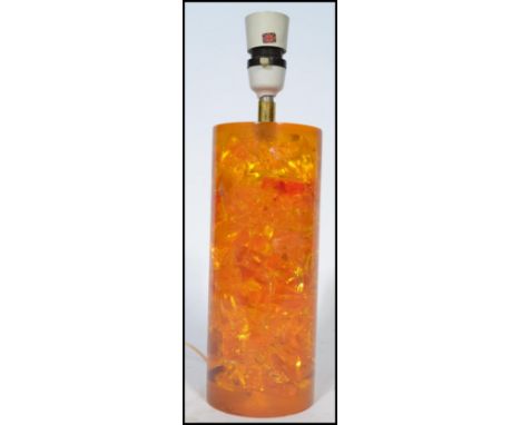 A retro vintage mid 20th century Shatterline amber type resin lamp base in orange colourway.&nbsp;Measures 33cm high.&nbsp;