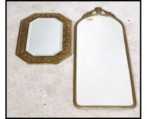 Two vintage 20th century antique style wall mirrors. One of octagonal form having a bevelled mirror panel in a gilt foliage d