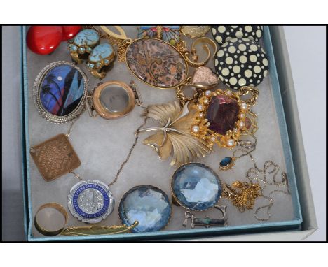 A collection of costume jewellery to include compact , purse , necklaces , bracelets , brooches , etc.