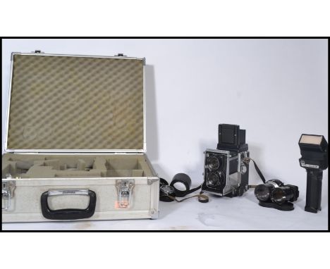 A vintage 20th century Mamiya C3 twin lens Professional Camera with additional items contained within a Hakuba flight case. M