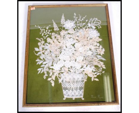 A mid century hand embroidered lace work panel of&nbsp; chrysanthemums&nbsp; in basket by Joan Payne being set to a green pan