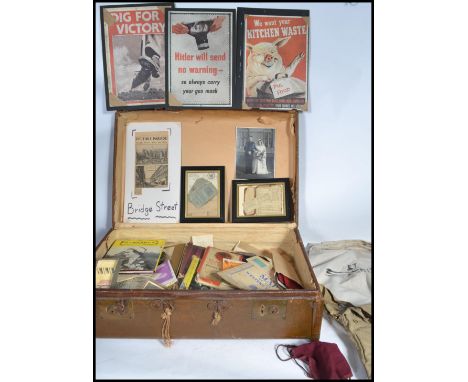 A large collection of ephemera held within a vintage suitcase to include licenses , photographs , military interest items , r