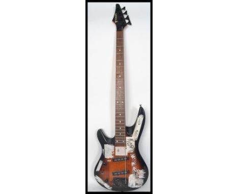 A vintage 20th century Samick bass guitar having inset mother of pearl fret markers.