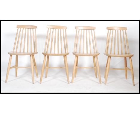 A set of four 20th century beech wood&nbsp; hoop back dining chairs in the manner of Ercol.&nbsp;Measures&nbsp; 82cm x 40cm x