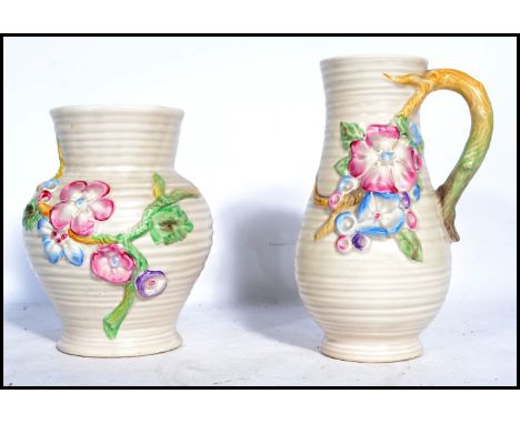 A Clarice Cliff early 20th century ewer / jug with floral vine and spray handle in the ' My Garden ' series. Cast mark for Cl