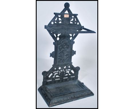 A Victorian cast iron aesthetic movement stick stand. Tray base with upright column back having pierced design. Rd no to vers