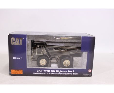 Norscot NZG - A boxed Commemorative 1:50 scale CAT 777D quarry dump truck in polished metal finish produced in 2005 to celebr