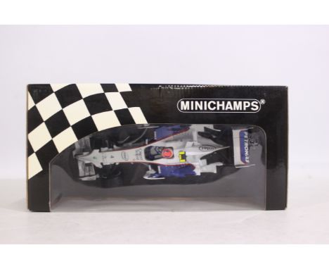 Minichamps - A 1:18 scale BMW Sauber F1 2008 Robert Kubica car # 100 080004. The model appears Mint in a Good box with some l