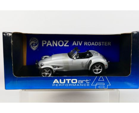 AutoArt - A boxed AutoArt #78212 1:18 scale '1998 Panoz AV Roadster. The model appears to be in Mint condition, housed within