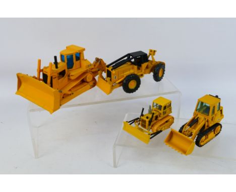 NZG - A group of unboxed CAT construction vehicles in 1:50 scale, a 953 tracked loader # 223, a 528 log skidder # 220, a D4 d