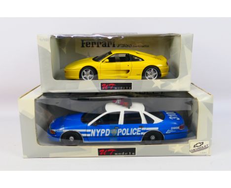 UT Models - Two boxed UT Models 1:18 scale diecast model cars, including Ferrari 355 Berlinetta; together with a Chevrolet Ca