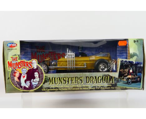 Joyride - A boxed 1:18 scale Joyride #33266 'Munsters Dragula'. The model appears to be in Mint condition, housed within a Fa