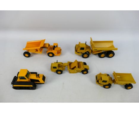 Ertl - Joal - A group of unboxed construction vehicles, CAT D25D articulated dumper, a CAT D613C elevating scraper, a D350D a