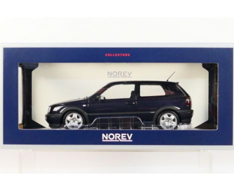 Norev - A boxed 1:18 scale Norev #188417 1196 VW Golf VR6. The model in metallic purple appears to be in Mint condition, hous