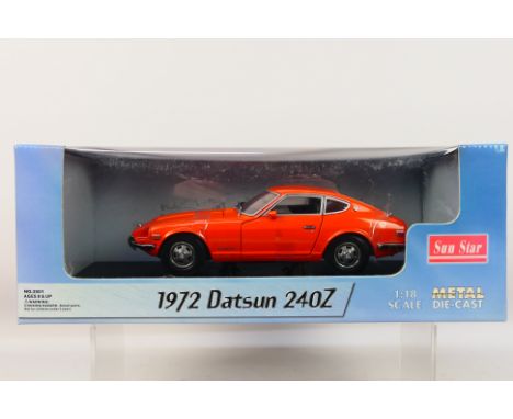 Sun Star - A boxed 1:18 scale Sun Star #3501 1972 Datsun 240Z.. The model in orange appears to be in Mint condition, housed w