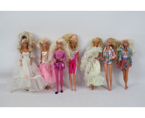 Mattel - Barbie - A collection of 7 x Barbie dolls including one in a wedding dress. The one in the denim jacket has a loose 