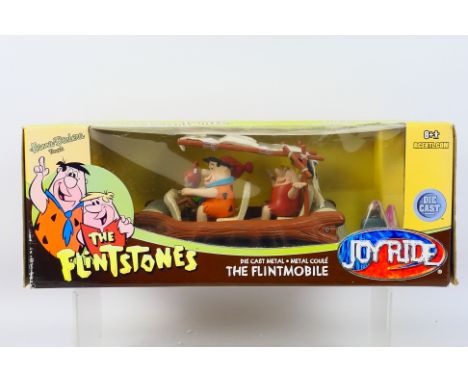 JoyRide - A rare boxed The Flintstones Flintmobile in 1:18 scale in die cast metal # 33735. The model appears Mint in a Good 