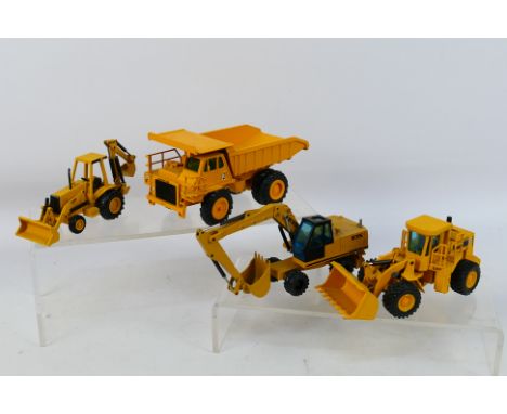 NZG - A group of unboxed 1:50 scale construction vehicles, a CAT 769C dump truck # 222,  a CAT 416 backhoe loader # 285, an E