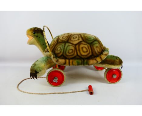 Steiff - A vintage 1950s/ 60s Steiff Ridie-On Slo Turtle. The mohair turtle measures approximately 31cms (H) x 50cms (L) x39c
