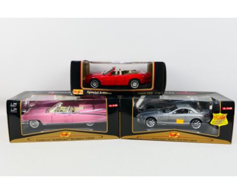 Maisto - Three boxed diecast 1:18 scale model cars. Lot consists of Maisto 'Premiere Edition' 1959 Cadillac Eldorado Biarritz