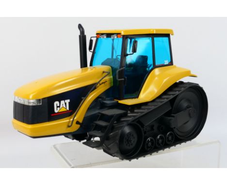 NZG - A 1:16 scale CAT Challenger 35 tracked tractor measuring 35 cm long # 426. The model appears in Near mint condition, no