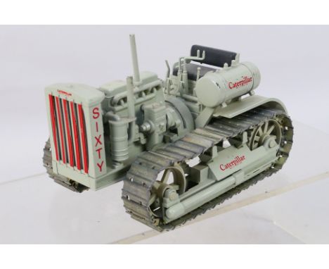 Conrad - A limited edition 1:25 scale 1931 Caterpillar Model Sixty Diesel crawler tractor released in 1991 for the CAT 60th A